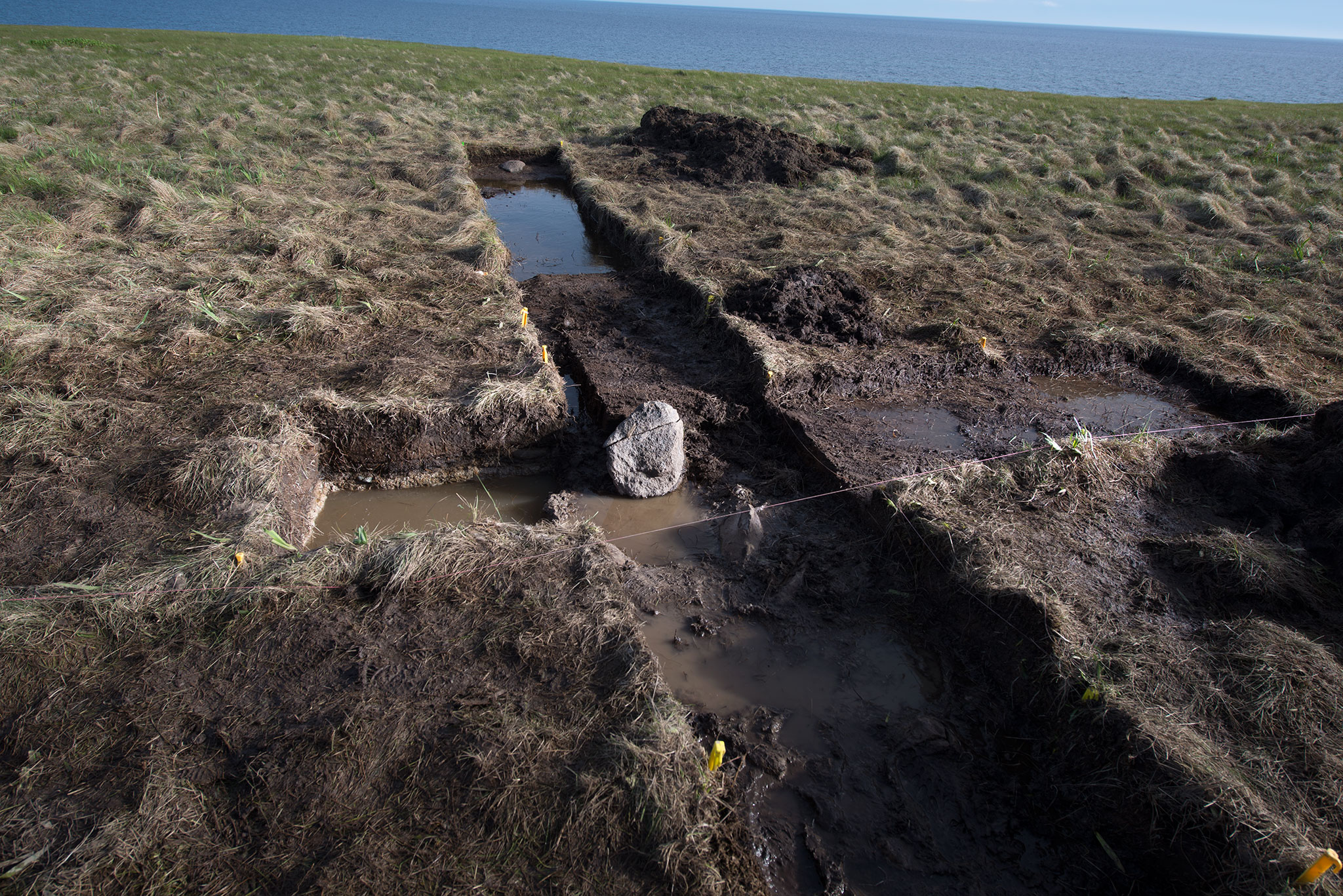 photograph of a possible stone-built iron ore drying hearth at Point Rosee / Point Rosie